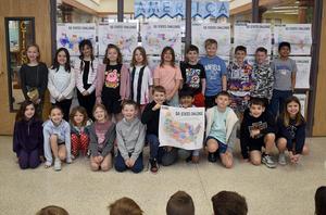 Group of students in front of a display titled '50 States Challenge'.