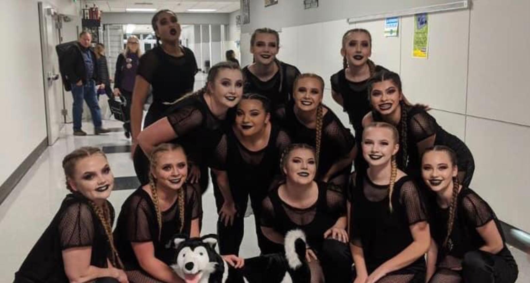 Dance team with Husky.