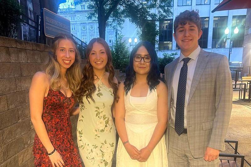 Lyla Gross, Maddy Longo, Rukhshona Rakhmatullaeva, and Aiden DeRiggi gather outside the Palace Theater award ceremony
