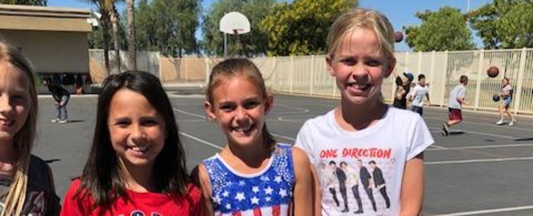 Students wearing red, white, & blue