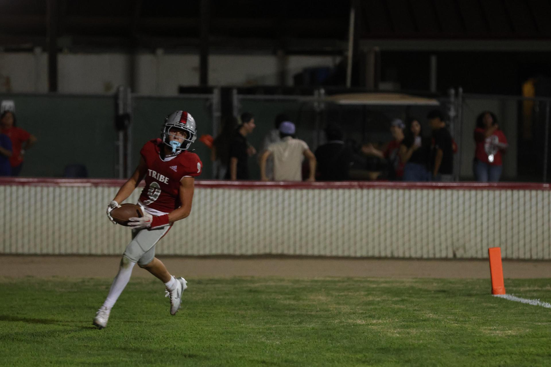 Varsity football players in action against Parlier 29
