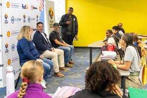 Panelists speak with students