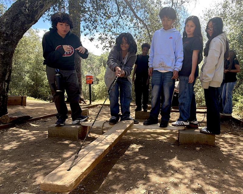 Students work together to create a simple bridge