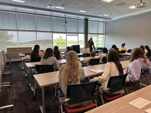 Students listening to Kristen