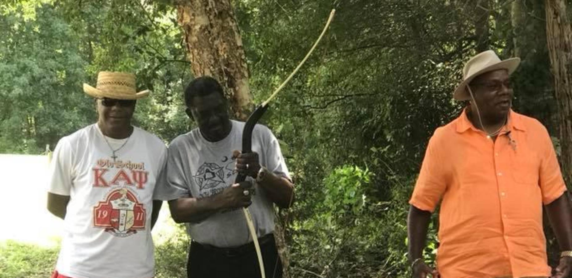 GOA Staff shooting bows and arrows.
