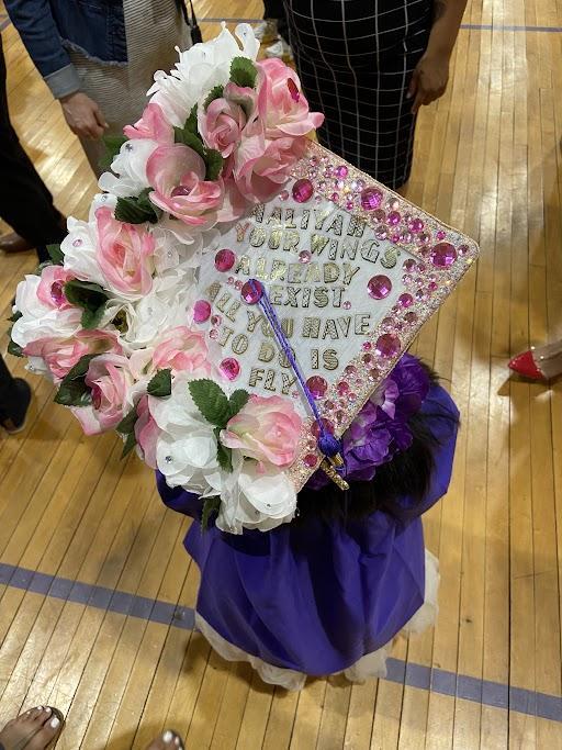 Photo of student wearing a graduation cap