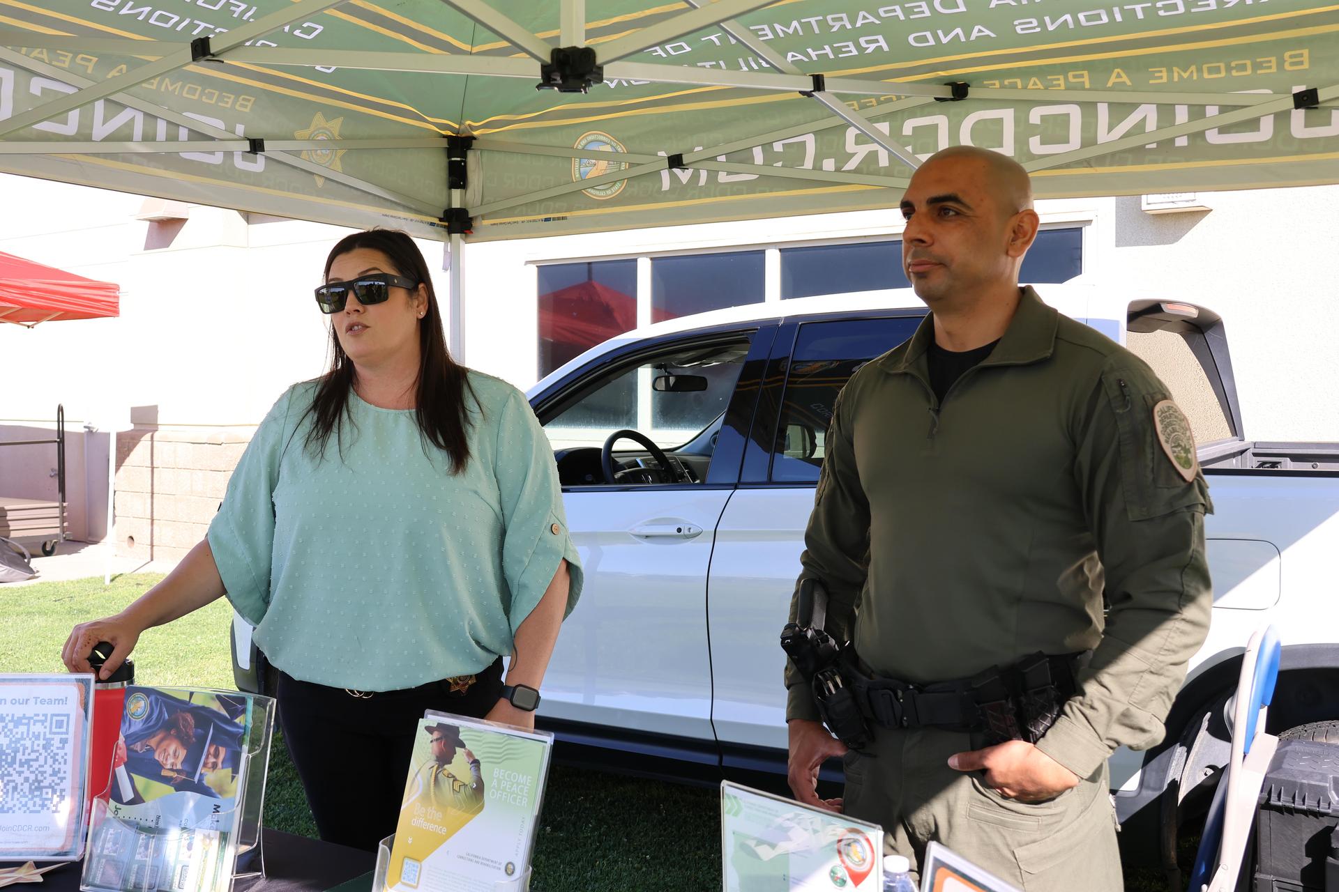 Correctional officers speaking to students