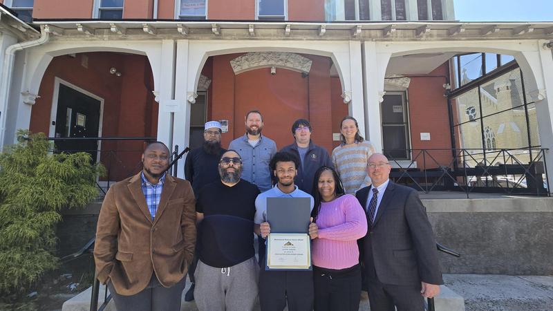MACS Staff with the awarded student, Lateef Jenkins and his family