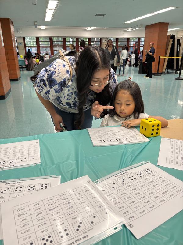 Families learning how to play a game together