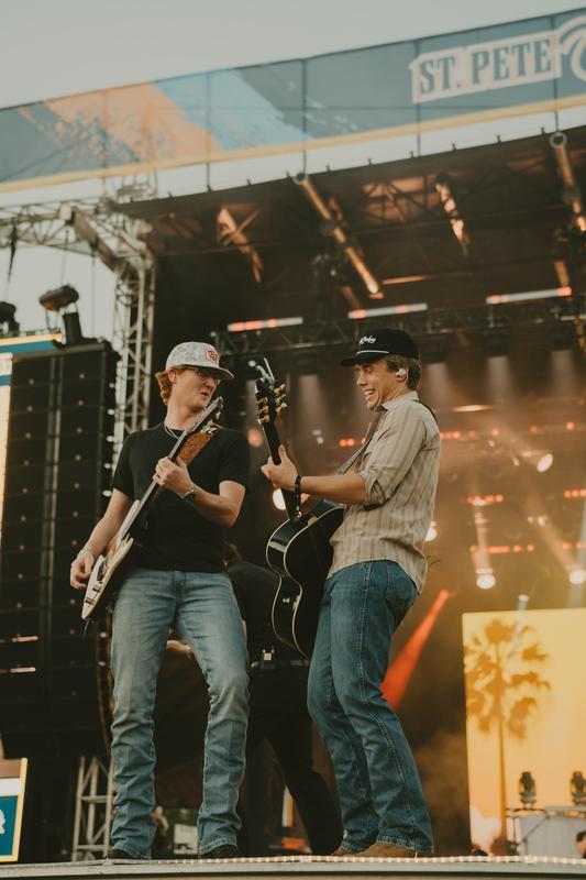 gage mcneely playing guitar next to hudson westbrook