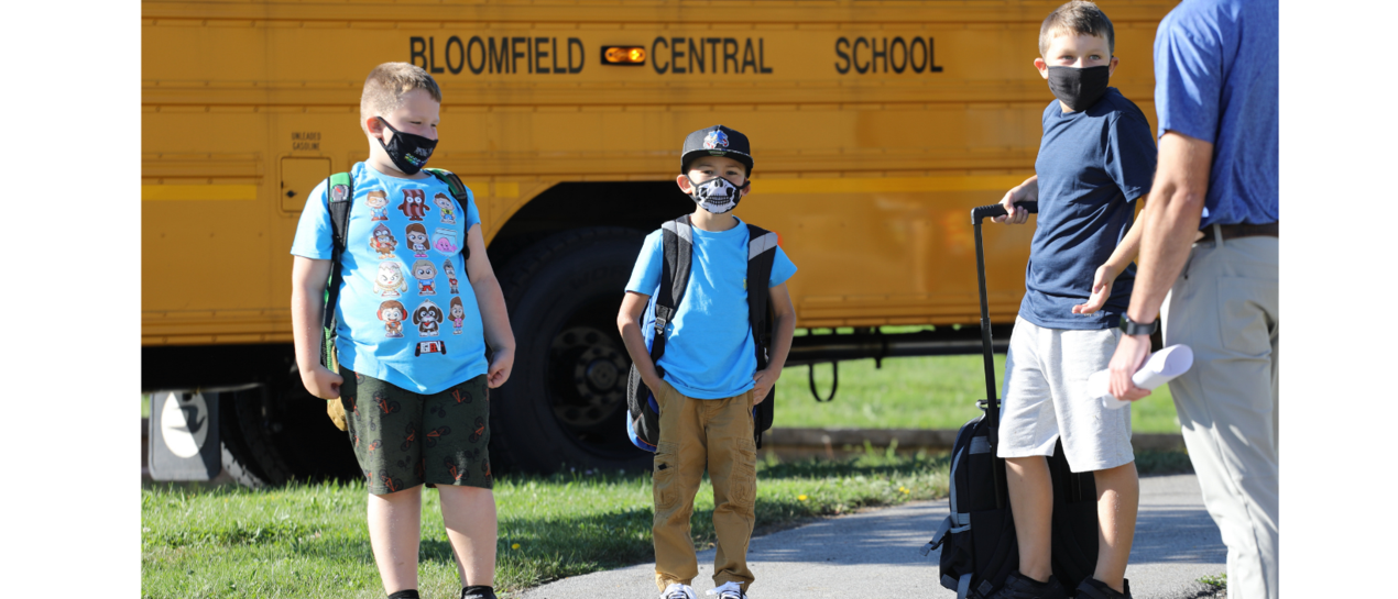 students getting off the bus
