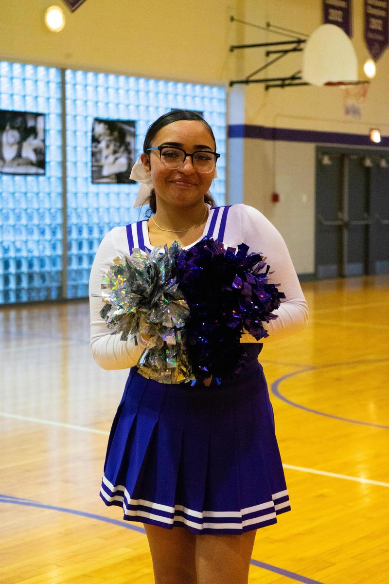 Student posing in cheer outfit