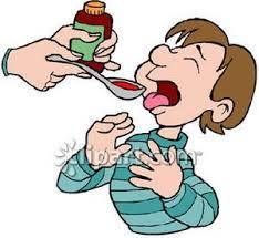 child receiving a spoonful of medicine