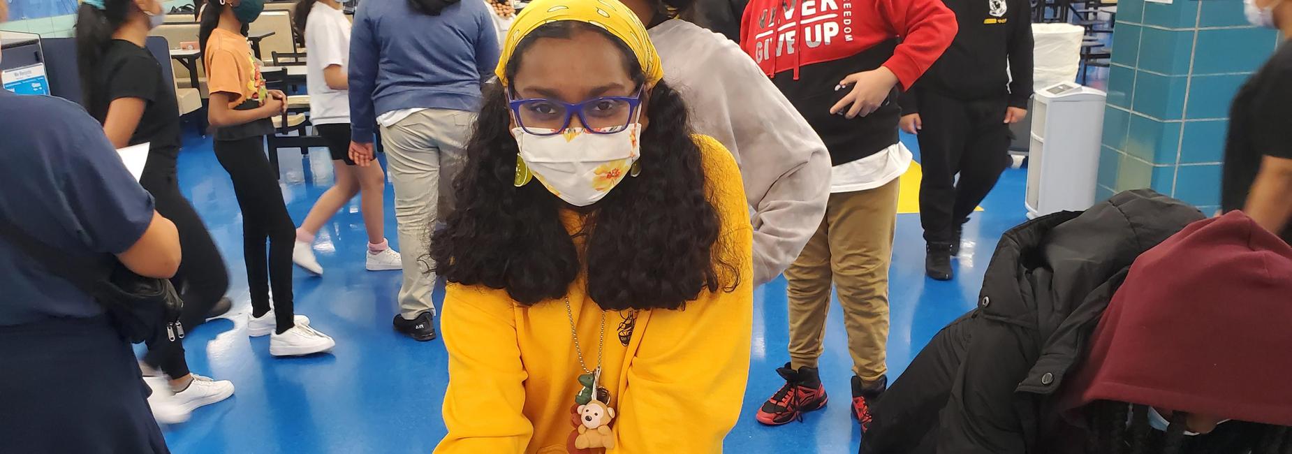 NYE student in yellow