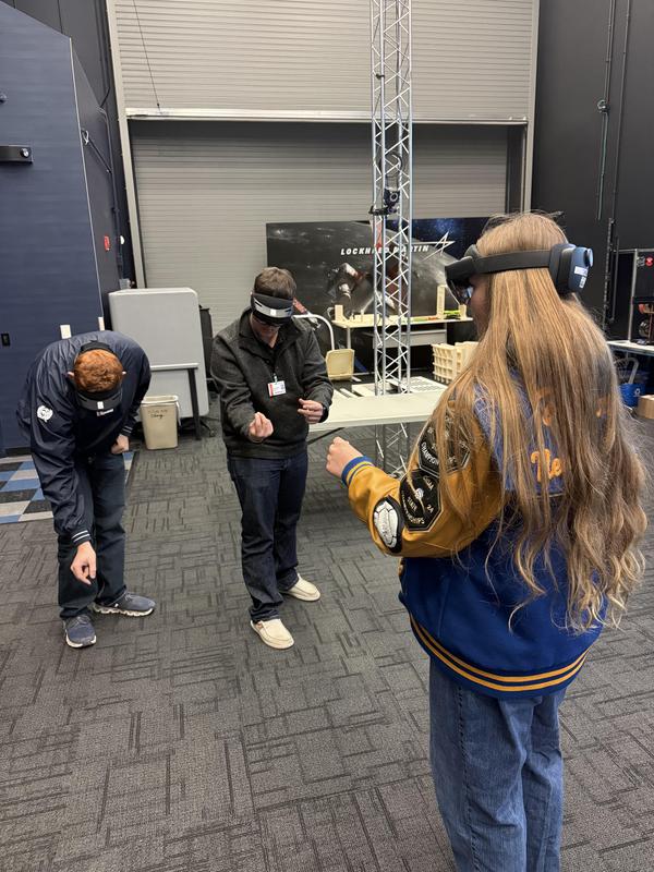 Students building a go kart engine with VR.