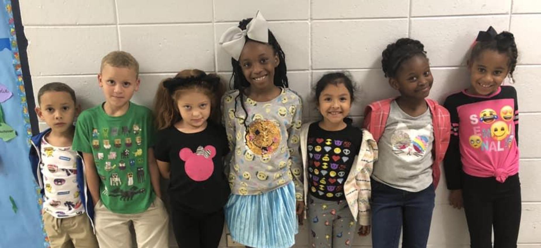 kids lined up smiling