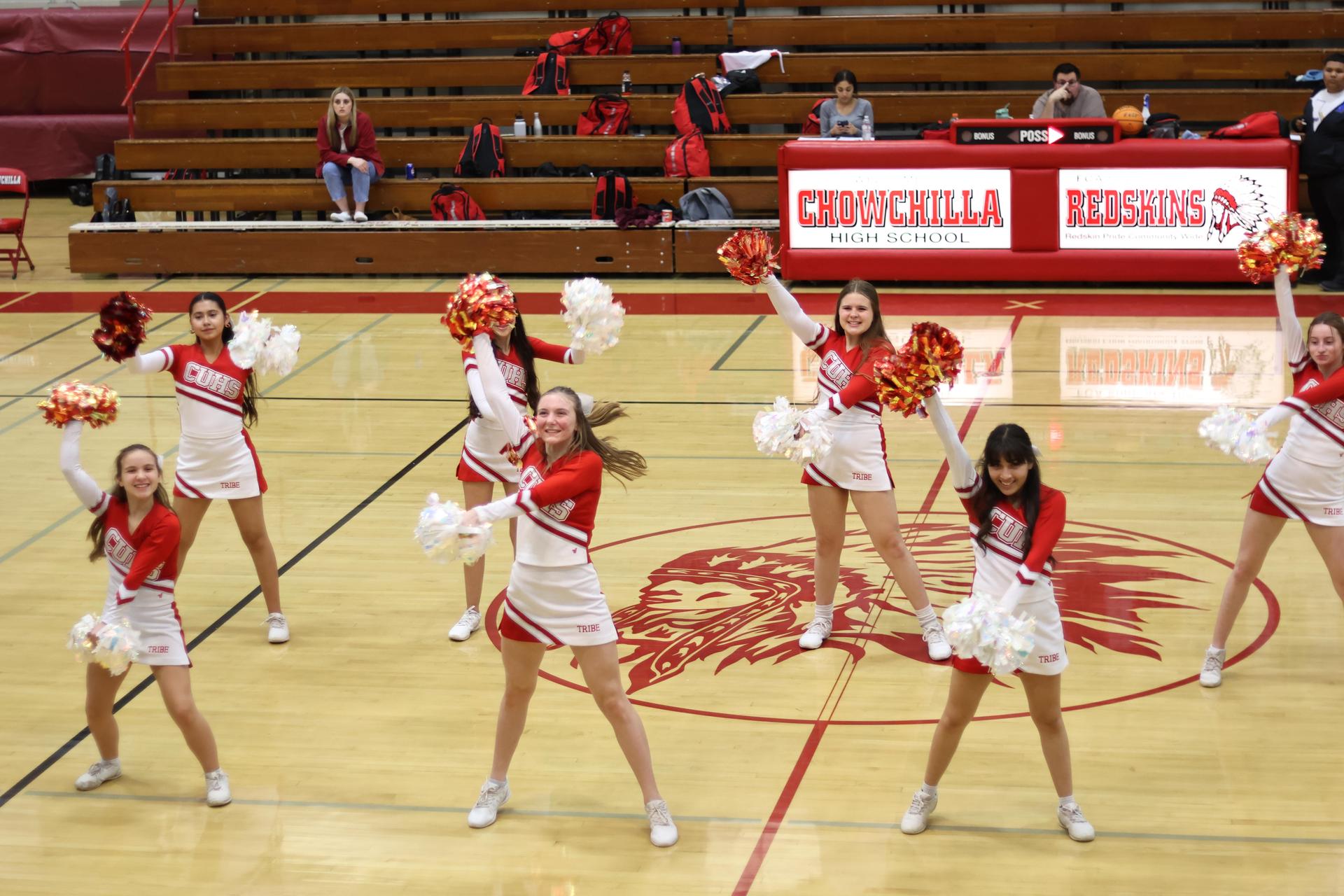 junior varsity cheerleaders cheering