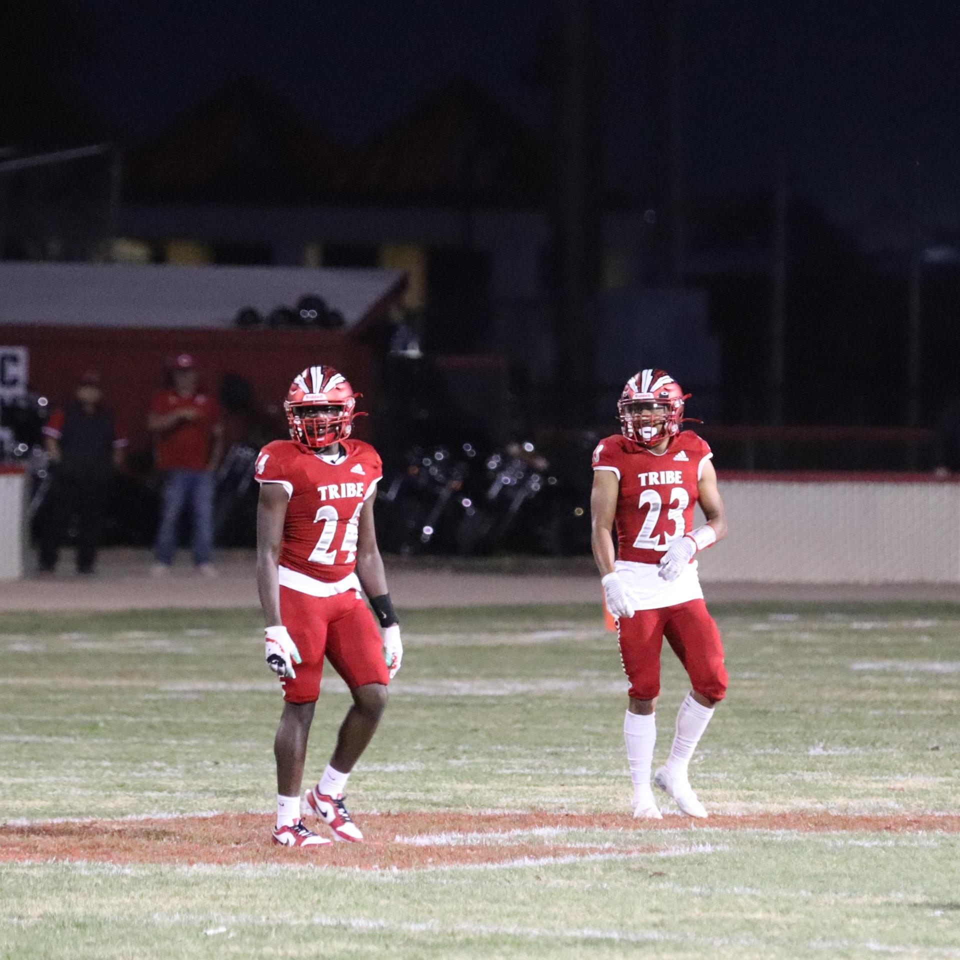 varsity football players in action against Riverdale