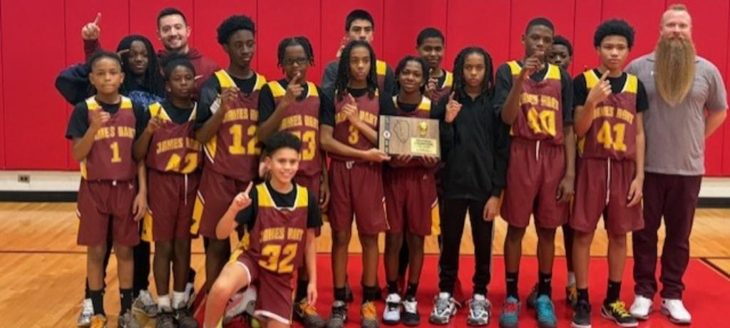 boys team poses with winning plaque