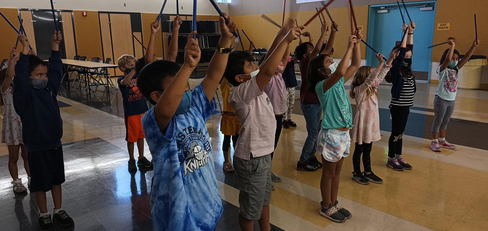 Room 28 playing music with instruments