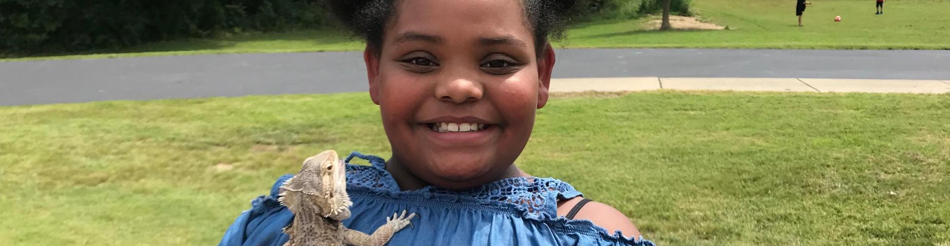 Girl holding a bearded dragon