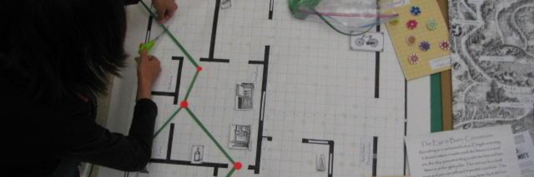 Student working on scale drawing during a math activity