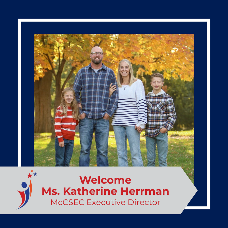 A family photo of Ms. Herrman, her husband, and two kids.