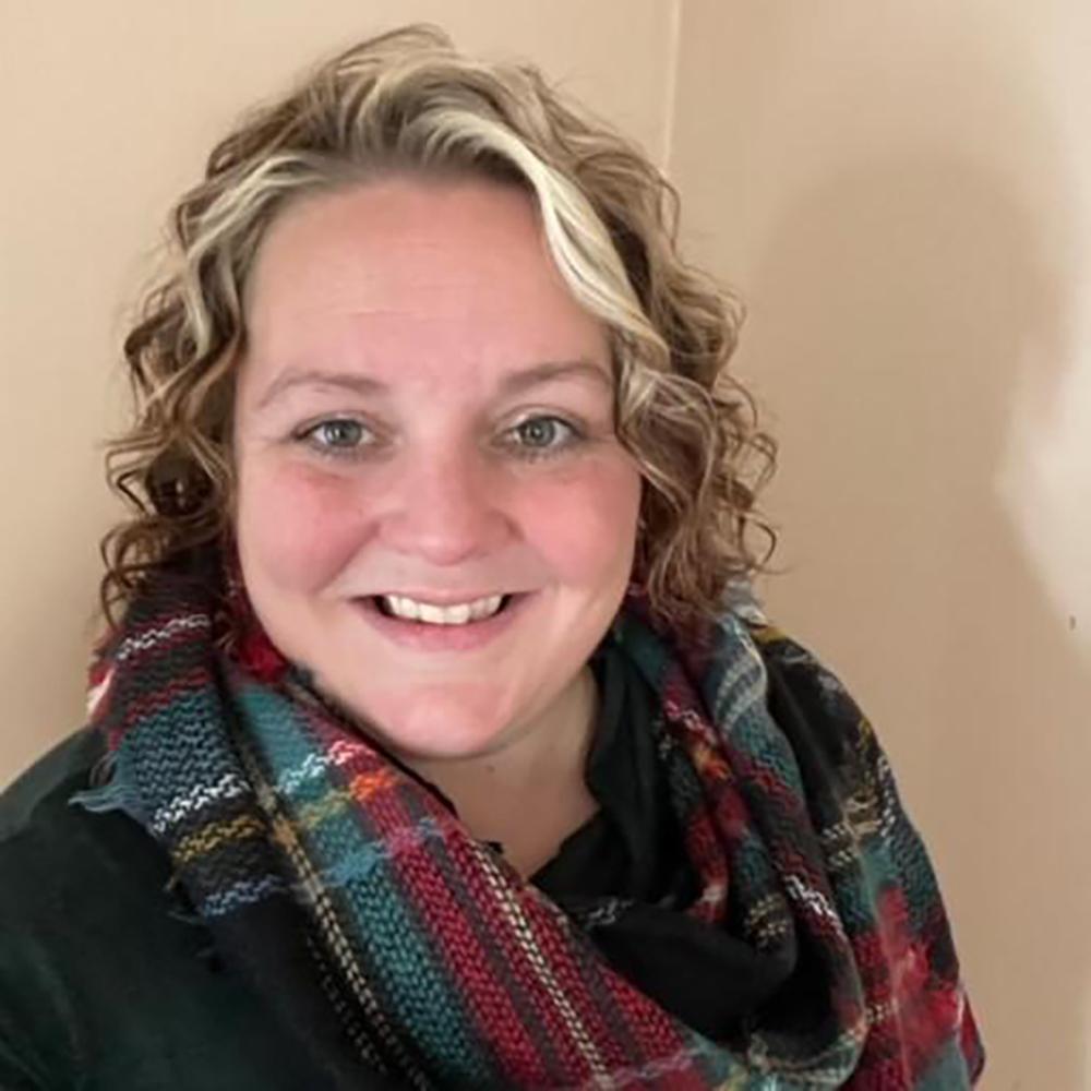 smiling woman in a scarf