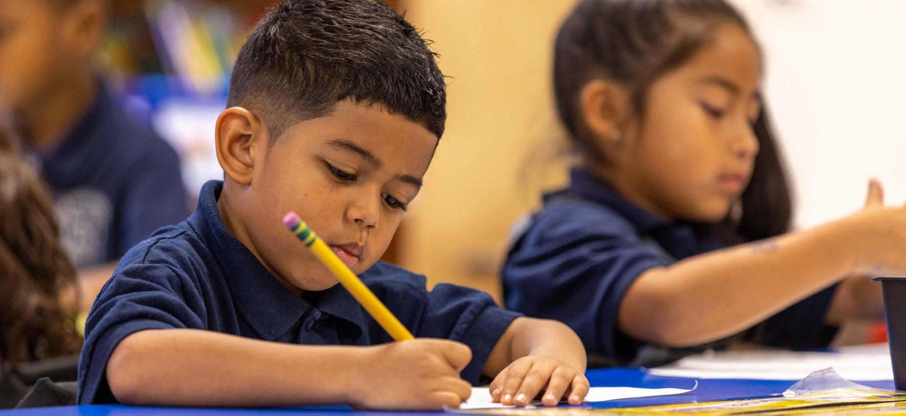 Scholars at work, writing and reading.