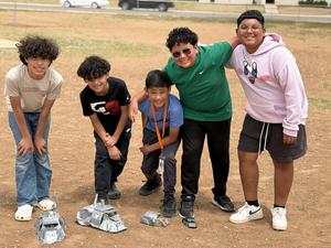 Ridgewood Elementary storm chasers pose and smile together on playground