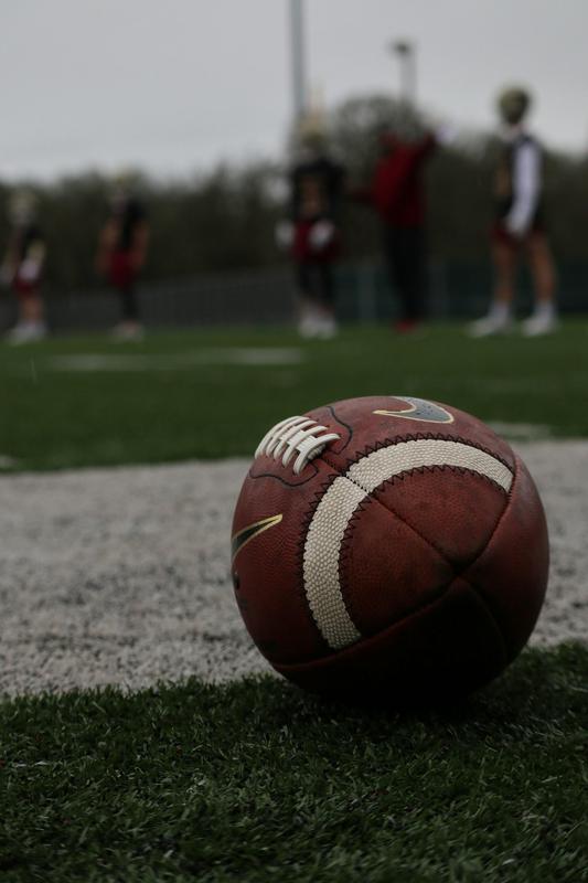 football laying on a green field