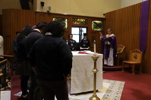 Extraordinary Ministers to be installed stand before the altar