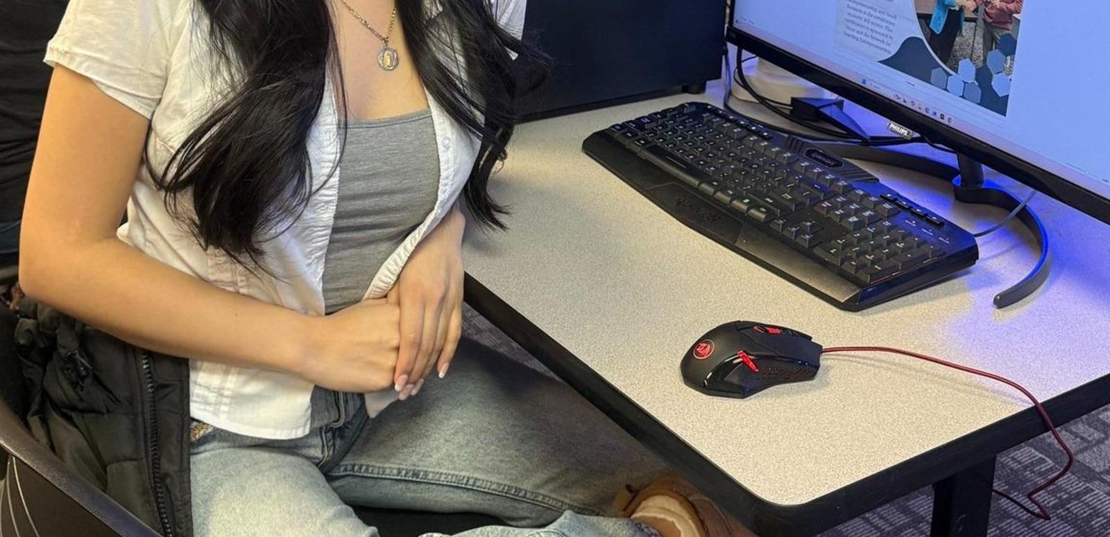 Student showcasing project on computer