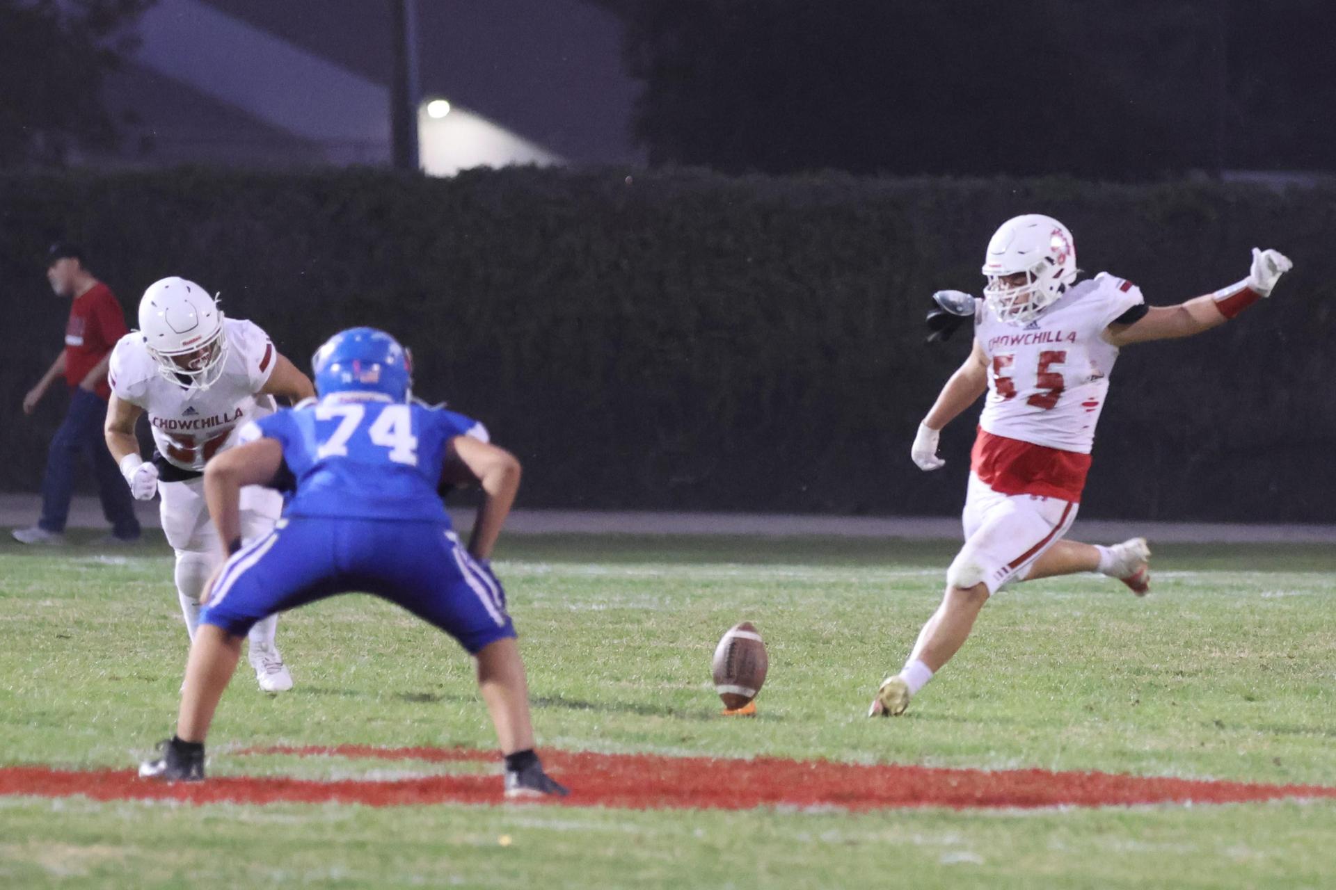 Junior Varsity football players in action against Caruthers