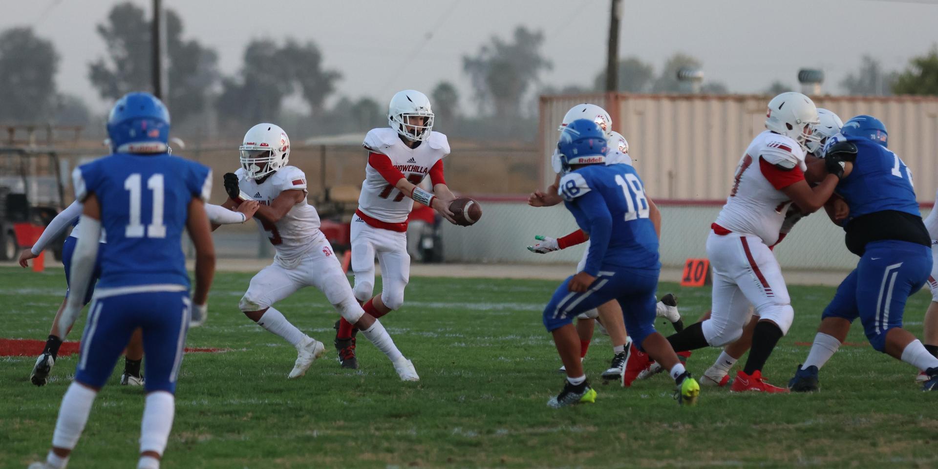 Junior Varsity football players in action against Caruthers