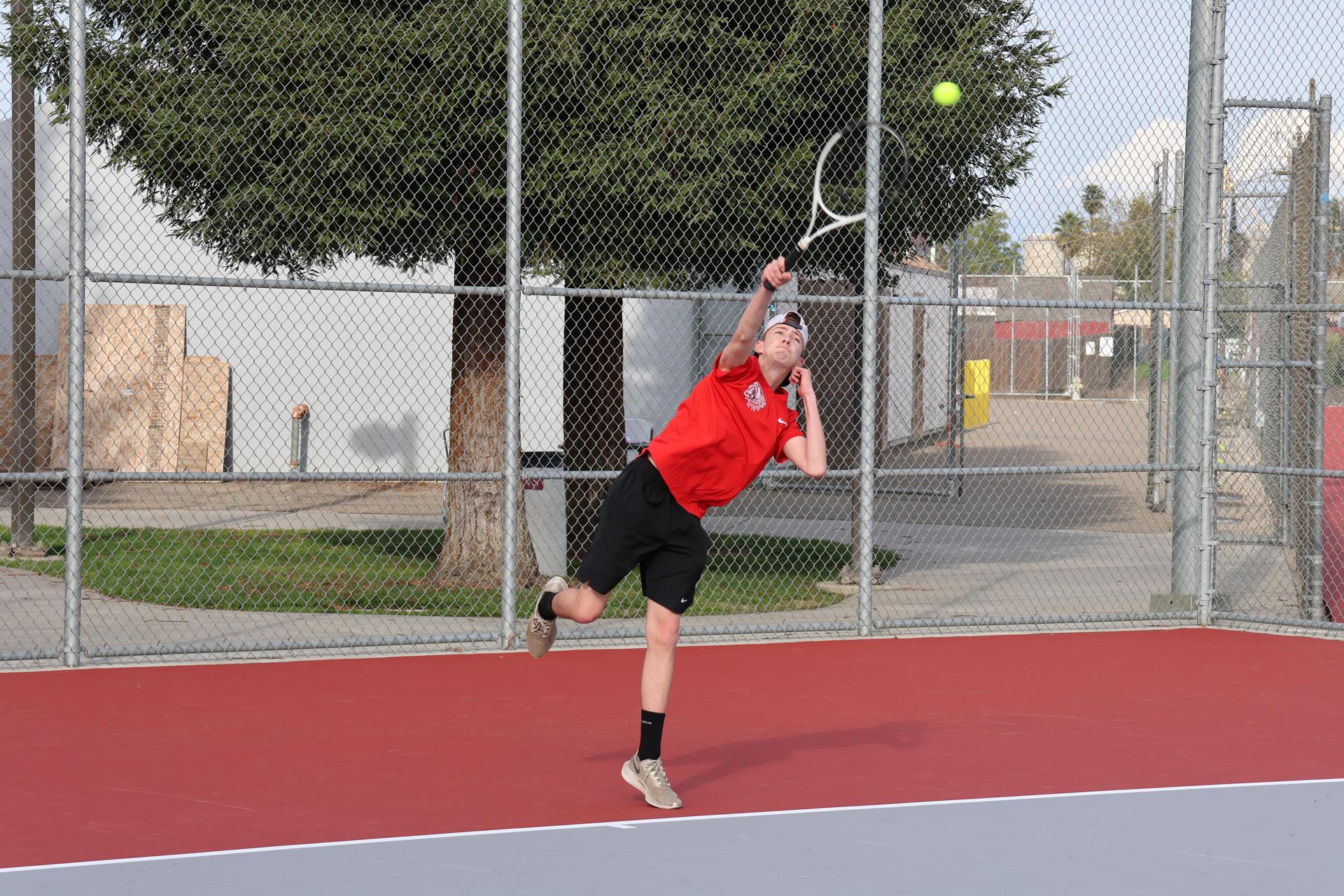 CUHS Boys playing tennis against coalinga