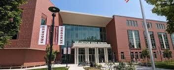 Mass Ave Entrance of Arlington High School - Red Brick Building around Glass Window Entrance