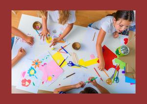 overhead photo of 4 kids coloring at a table