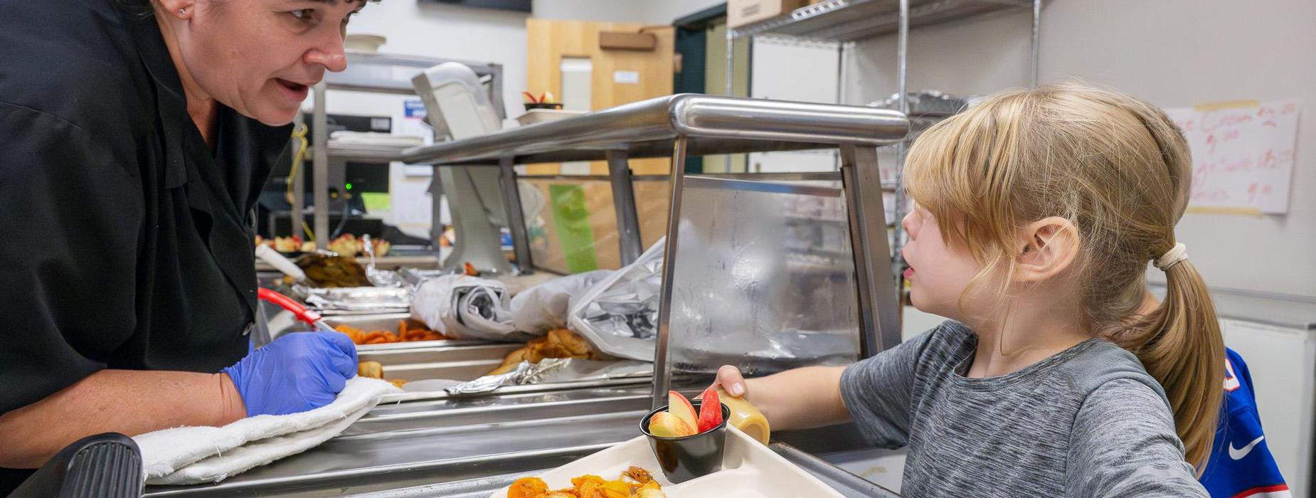 cafe worker serving student