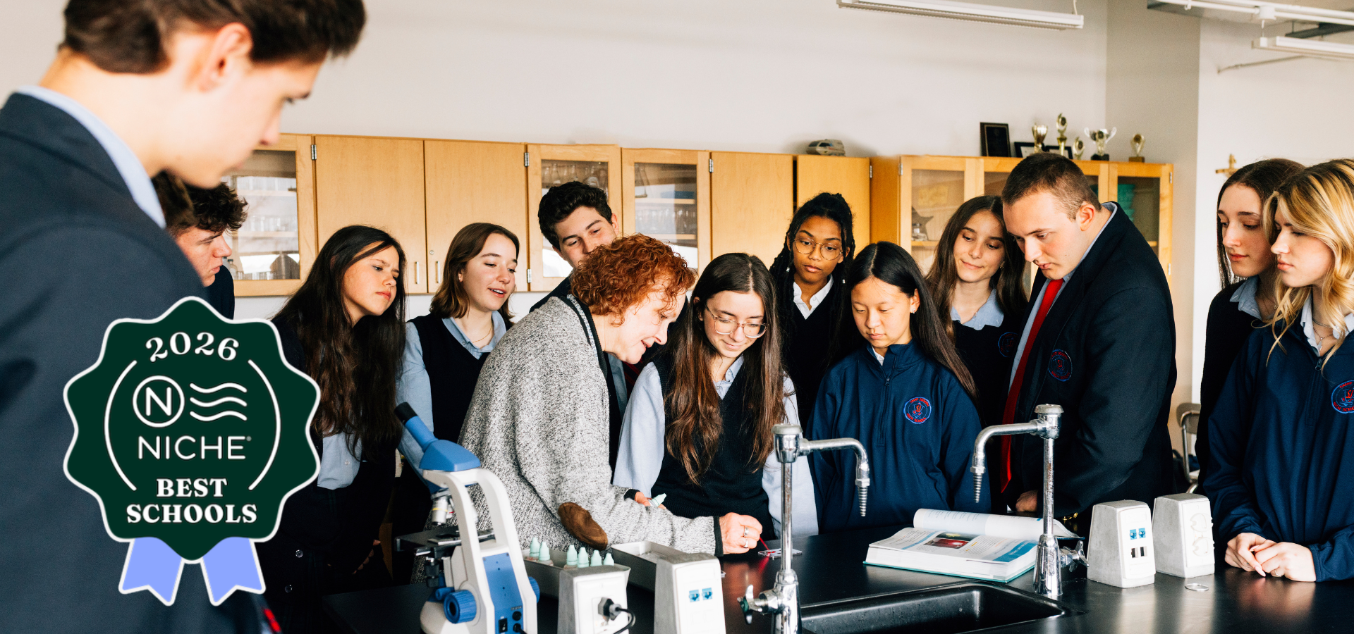 Students & teacher in science lab.
