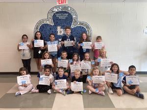 students who excelled and are showing off their top dog award