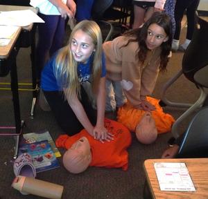 Students get to practice CPR in one of the  Career Fair presentations.