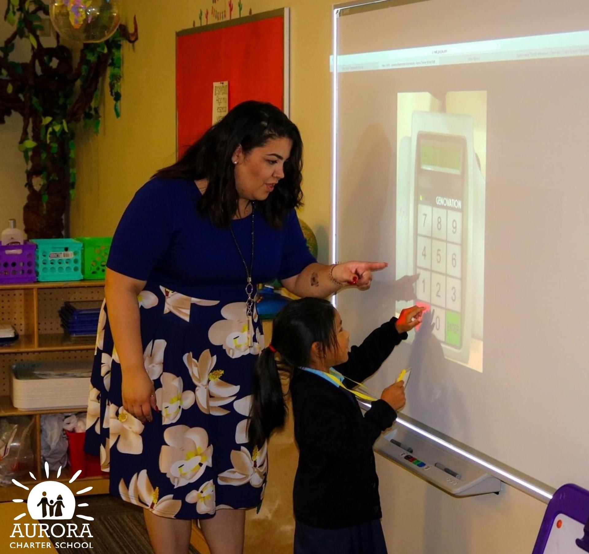 Teacher with Student at SmartBoard