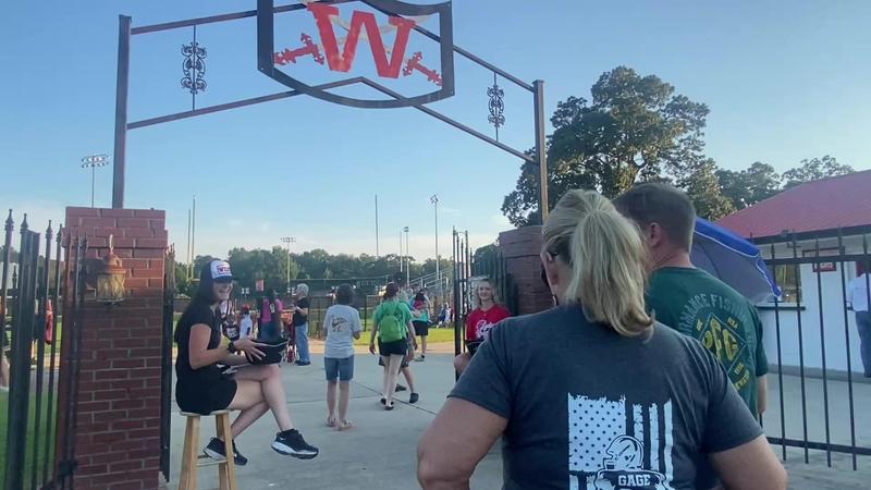 West Lauderdale High School football stadium gate entrance with fans entering