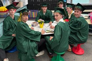 Daniel Lerro, Matthew Lerro, Sean Goodman, Jake Lenart, Luke Fox, Cameron King, and Niko Cox take a seat during their walk through at Trafford Elementary