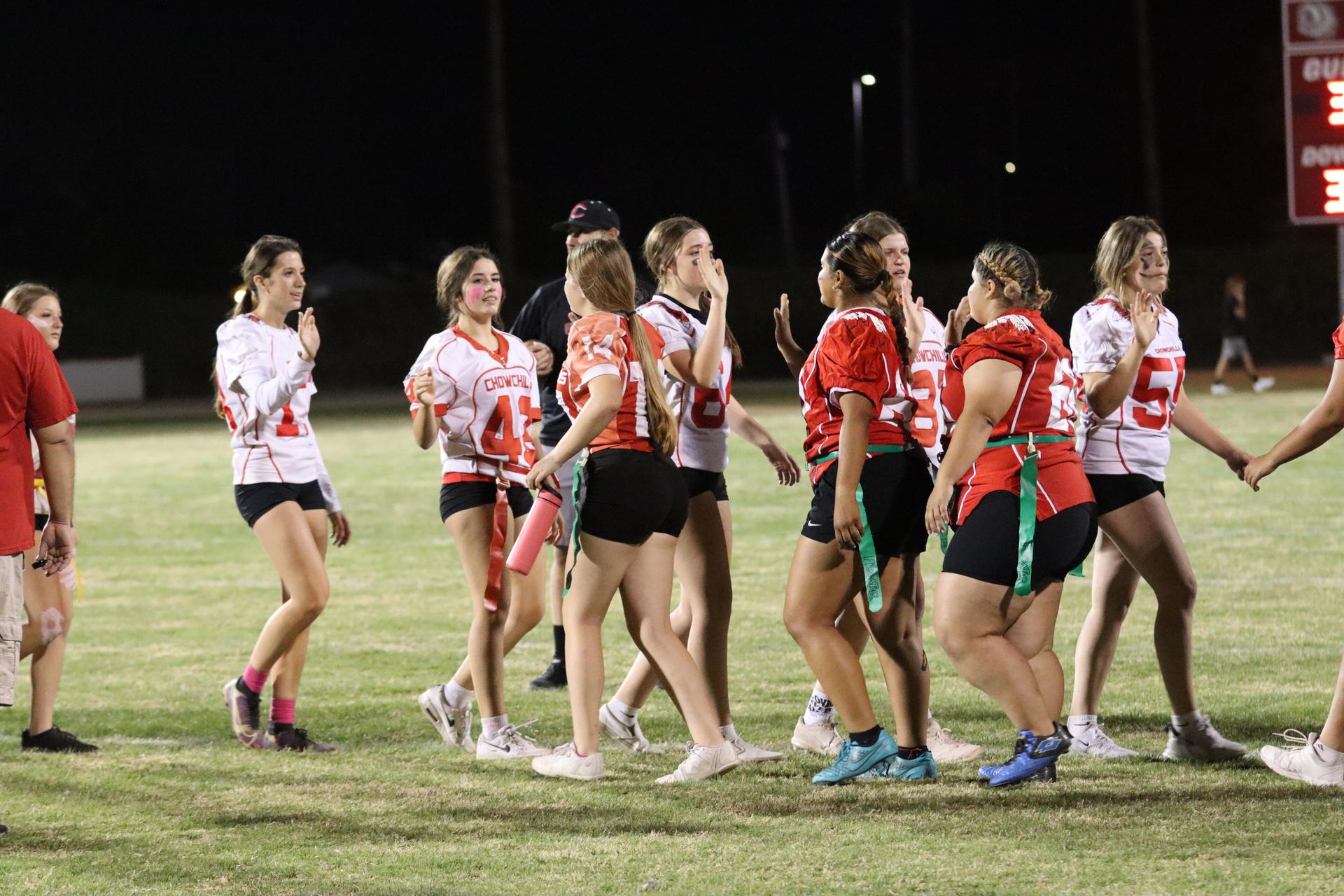 students shaking hands after the game