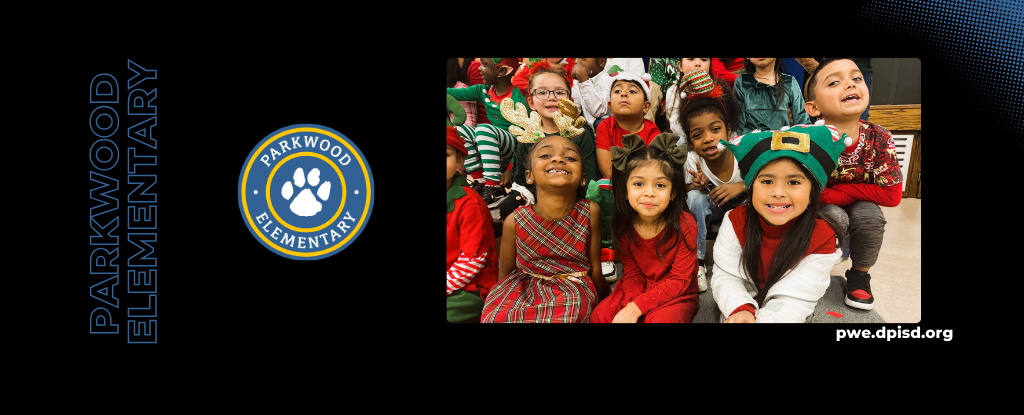 Group of children in holiday outfits, some wearing hats and joyful expressions, gathered together.