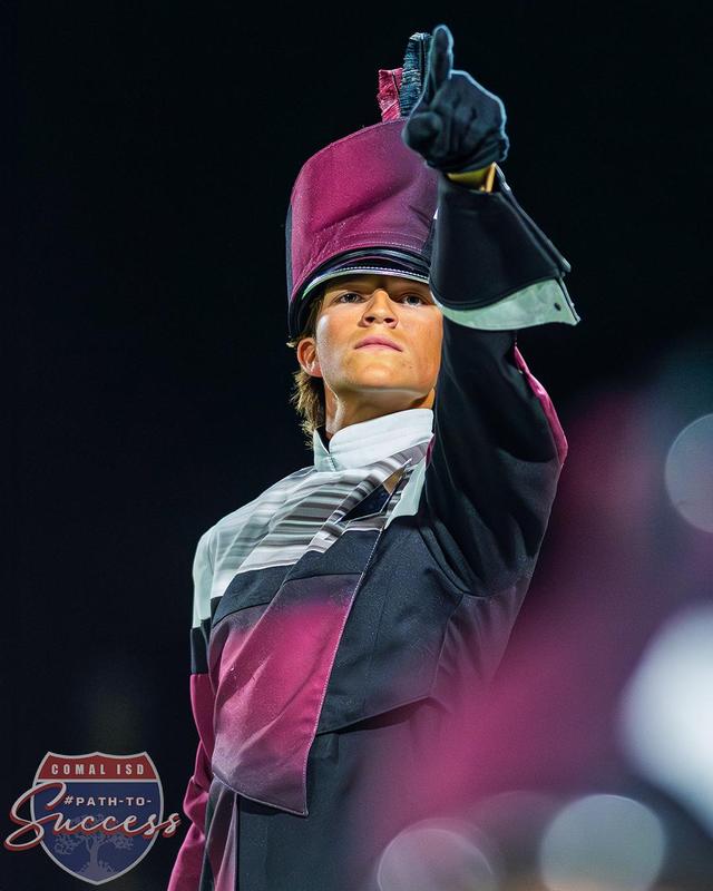 Action photo of Davenport High School senior Caleb Atkins during a band performance.