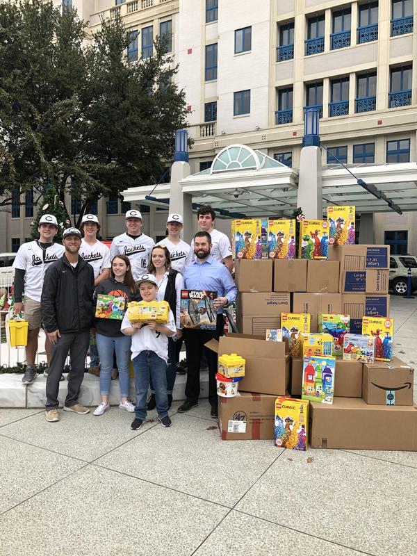 Yellow Jackets baseball team joins with Nelson family in delivering Legos to Cook Children's