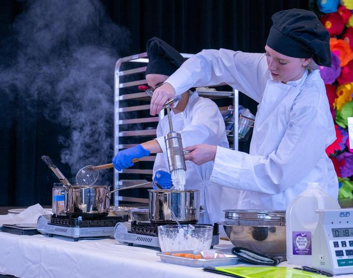 Students participating in cooking competition